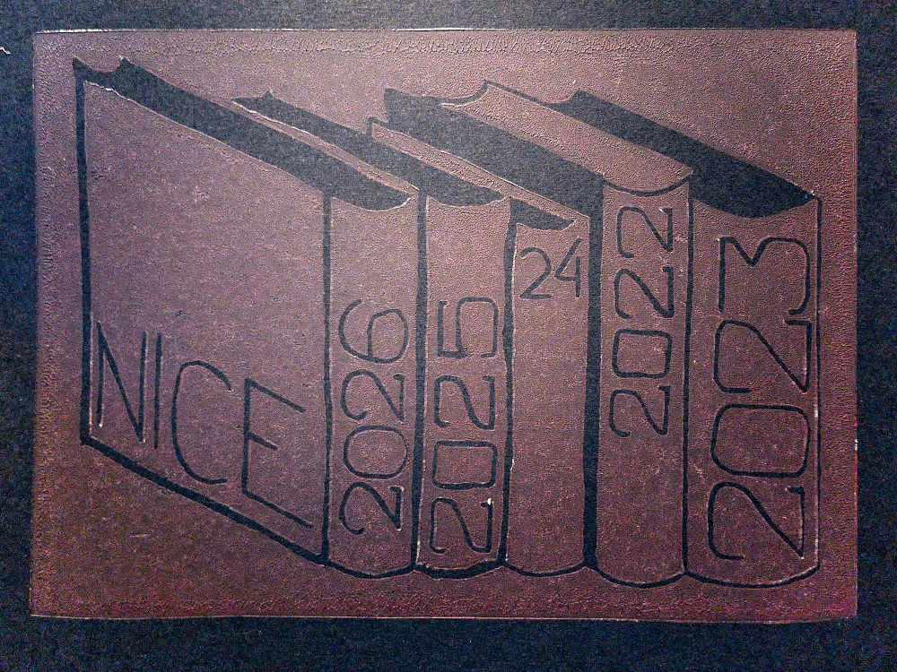 A lino cut print of books.